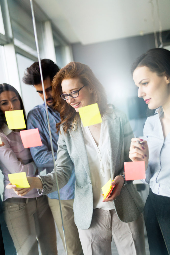 Collaboration and analysis by business people working in office